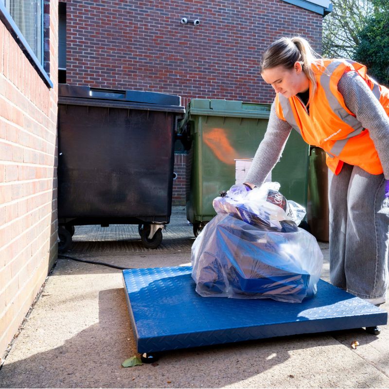 Staff separating waste into the correct stream